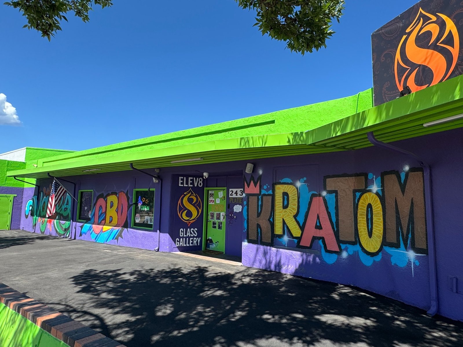 Purple and green Knob Hill storefront with the main Elev8 Glass Gallery entrance